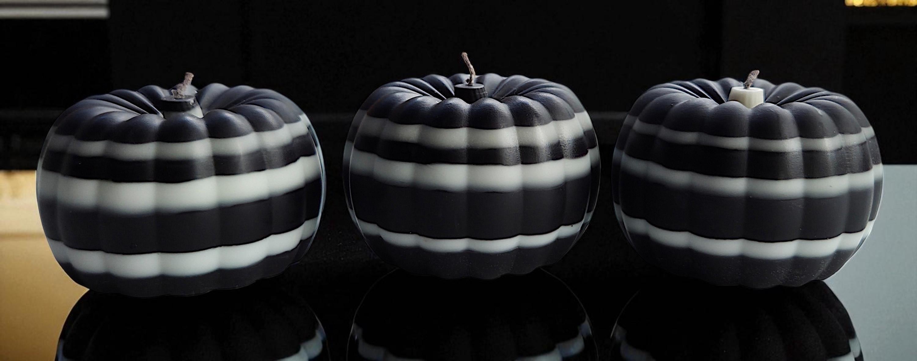 Ebony & Ivory Halloween skull candles and pumpkins. The beauty of black and white.